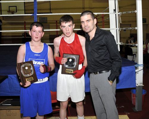 Paul Walsh and Derek Ward being presented with their trophies by Bernard Dunne following their bout on the night of the Oughterard boxing social. | Tom Broderick